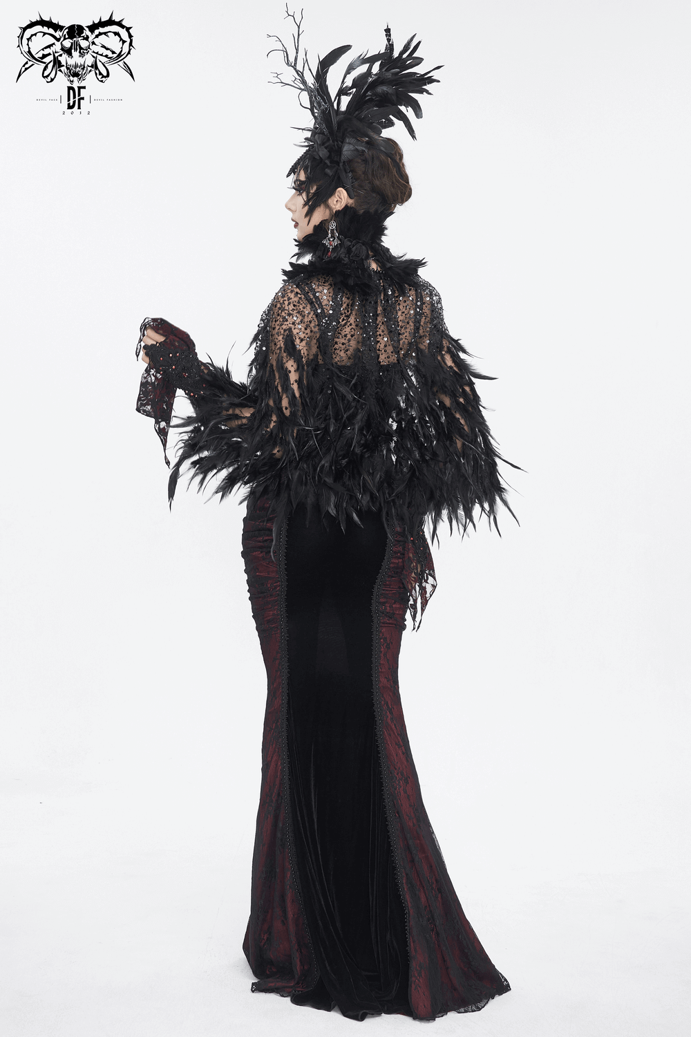 Gothic black dress with elegant lace and feather accents, showcasing a stunning back view.