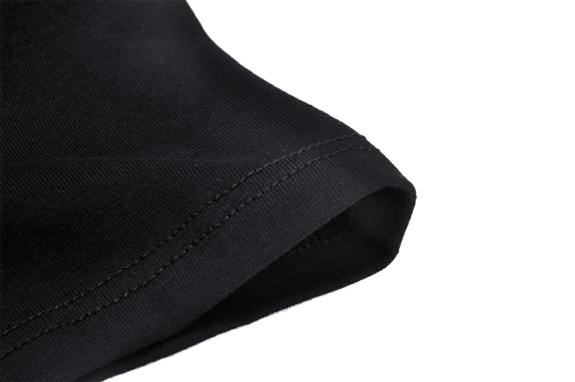 Elegant Black Crop Top with Unique Neckline and Chain Detail