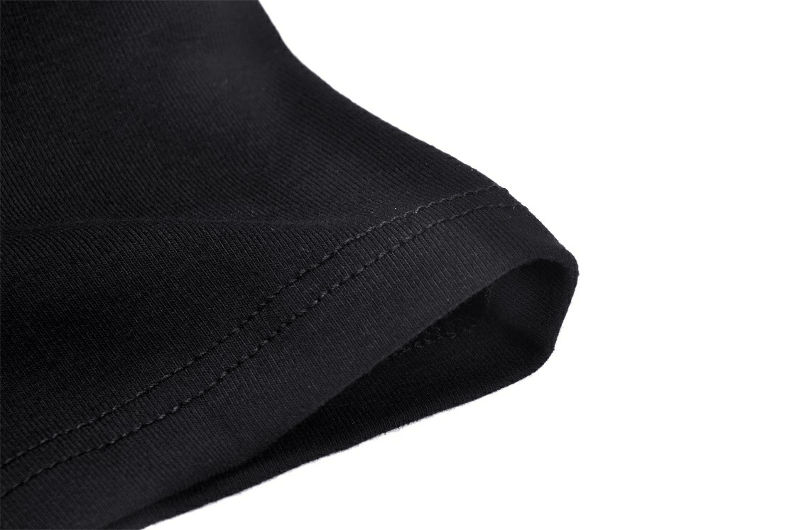 Close-up of the elegant black crop top showcasing the soft fabric and detailed stitching on the neckline.
