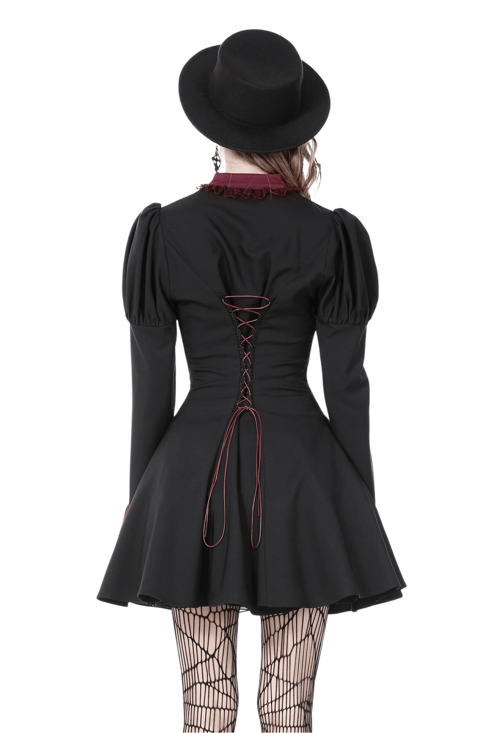 Back view of elegant black dress with burgundy lace and lace-up detail, paired with a stylish black hat.