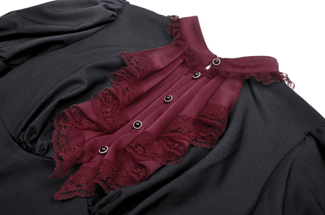 Elegant black dress featuring burgundy lace ruffle and button detail, perfect for vintage-inspired evening events.