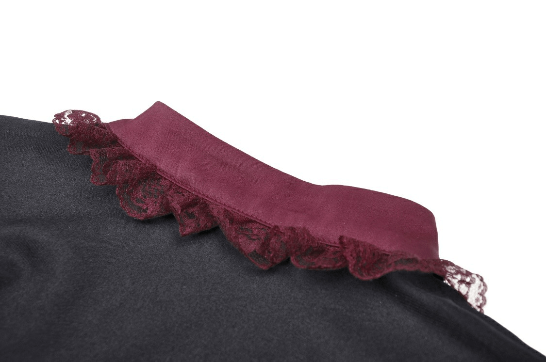 Close-up of burgundy lace collar detail on an elegant black dress, highlighting vintage-inspired charm.