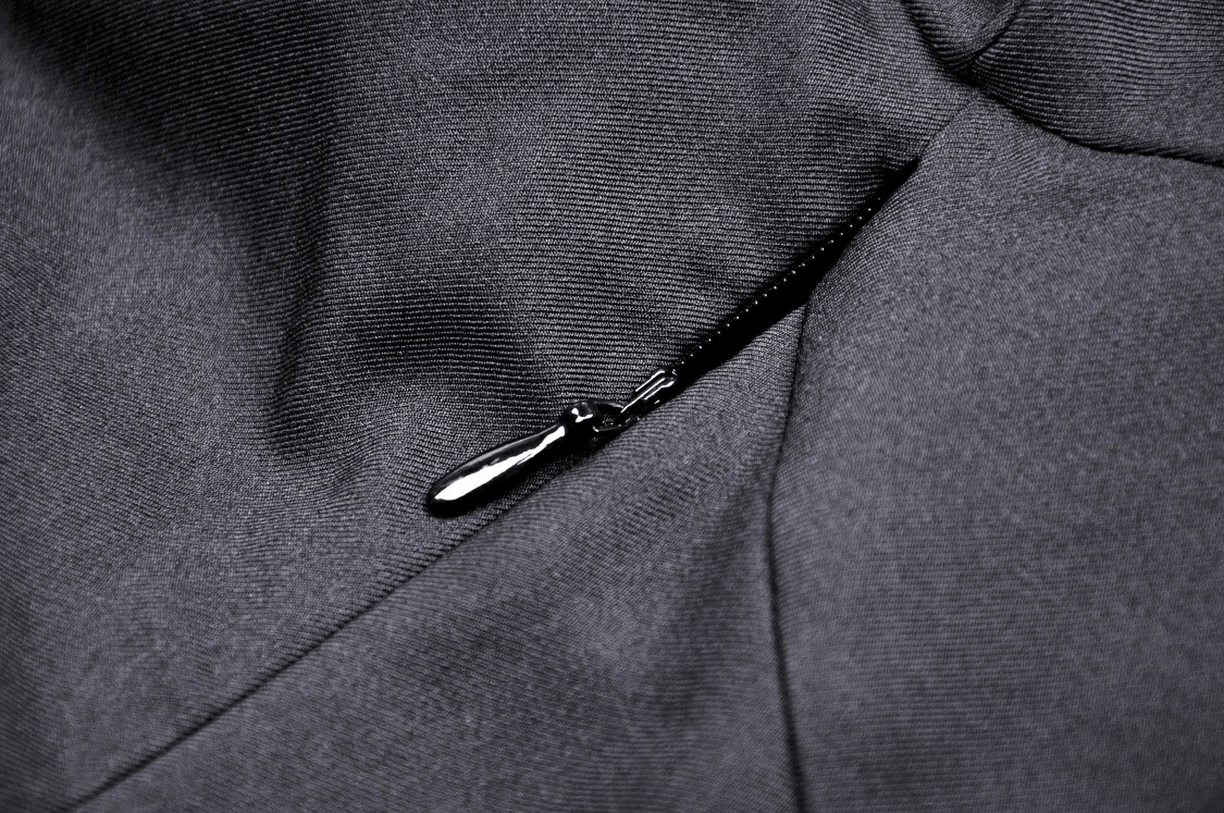 Close-up of a black dress zipper, highlighting its sleek design and elegant finish for a sophisticated look.