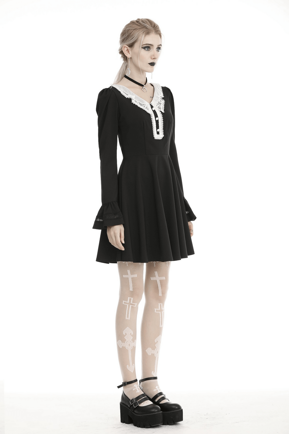 Elegant black dress with white lace collar and cuffs, paired with trendy accessories for a vintage-inspired look.