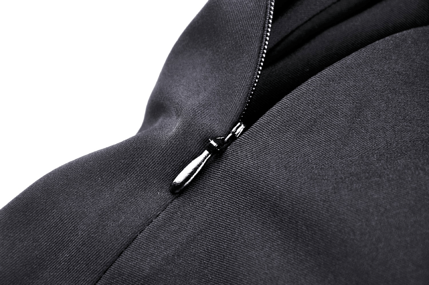 Close-up of sleek black dress zipper detail, showcasing stylish craftsmanship and modern design.