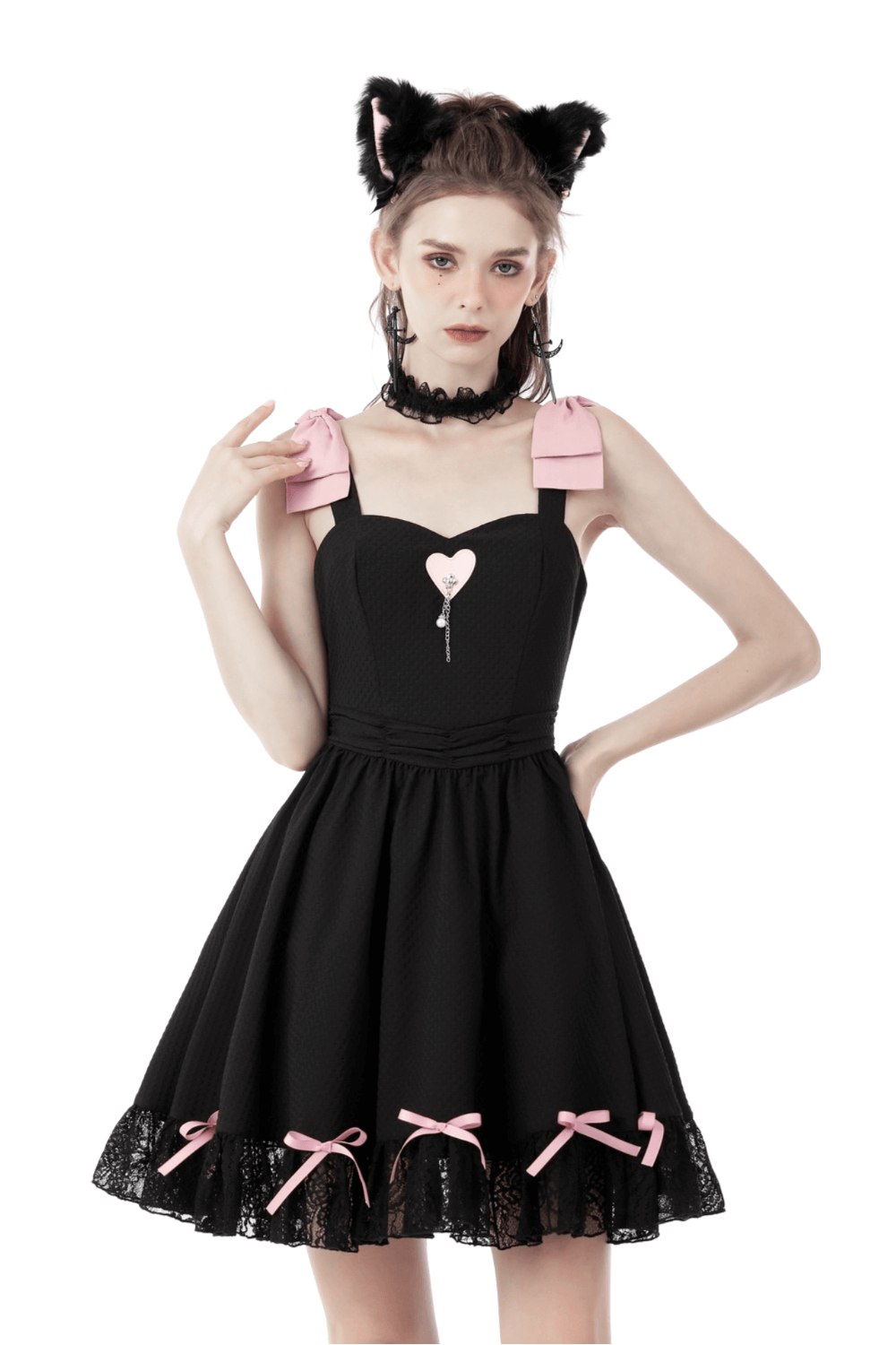 Chic black dress with pink ribbons, lace details, and heart pendant, perfect for parties and special occasions.