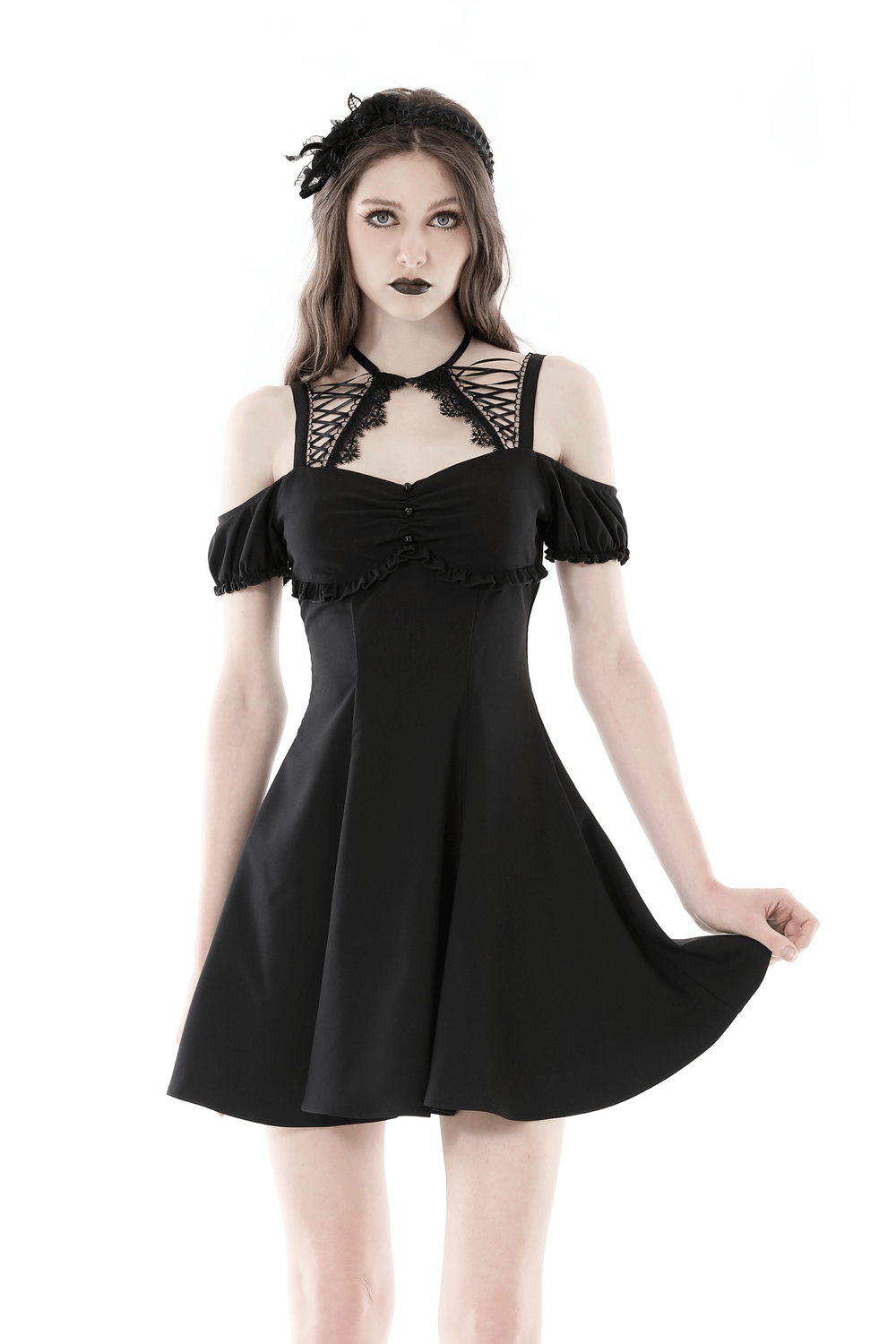 Elegant black gothic mini dress with unique strappy neckline and sleeve details, perfect for striking a stylish statement.