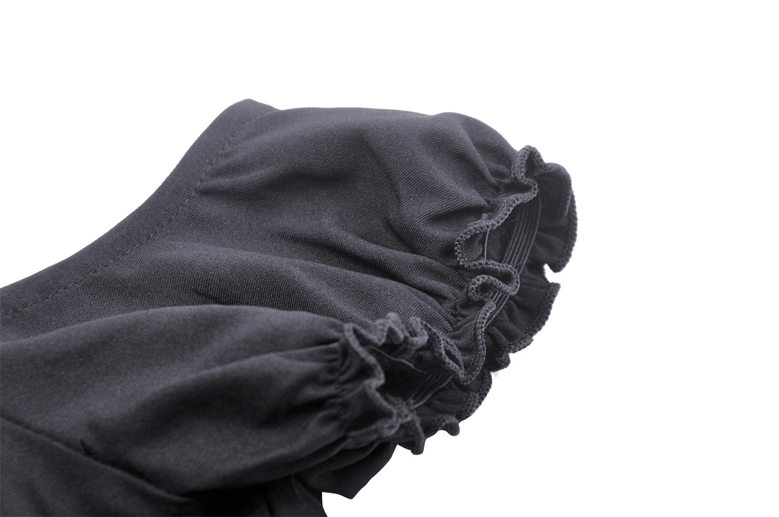 Close-up of the ruffled sleeve detail of an elegant black gothic mini dress with strappy accents.