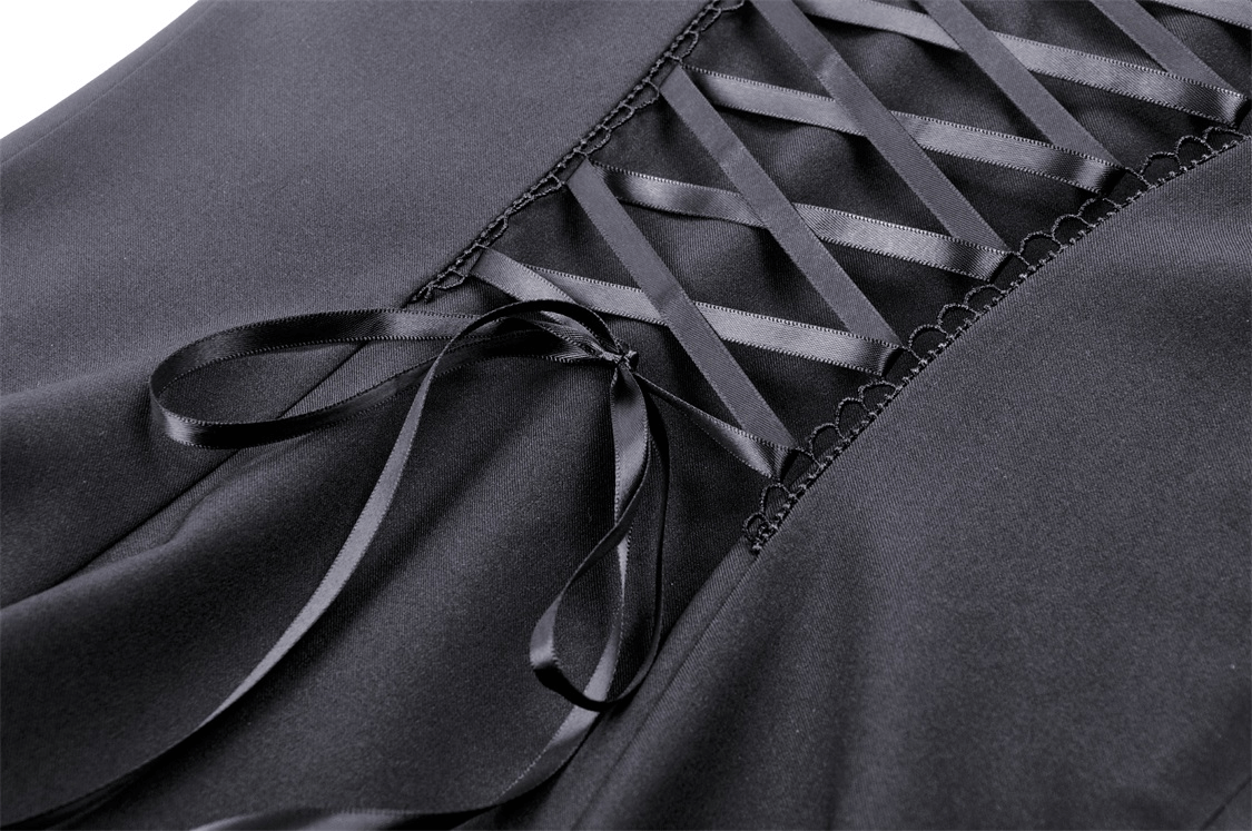 Close-up of an elegant black dress featuring unique strappy neckline and intricate ribbon detailing.