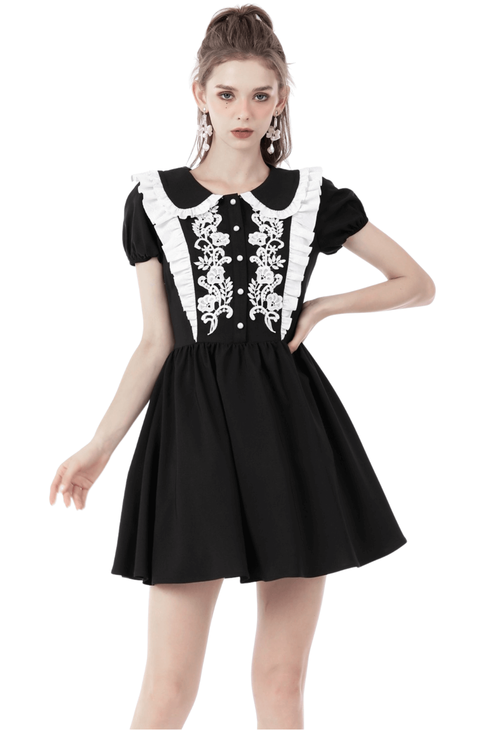 Chic black dress with white floral embroidery and Peter Pan collar, perfect for any elegant occasion.