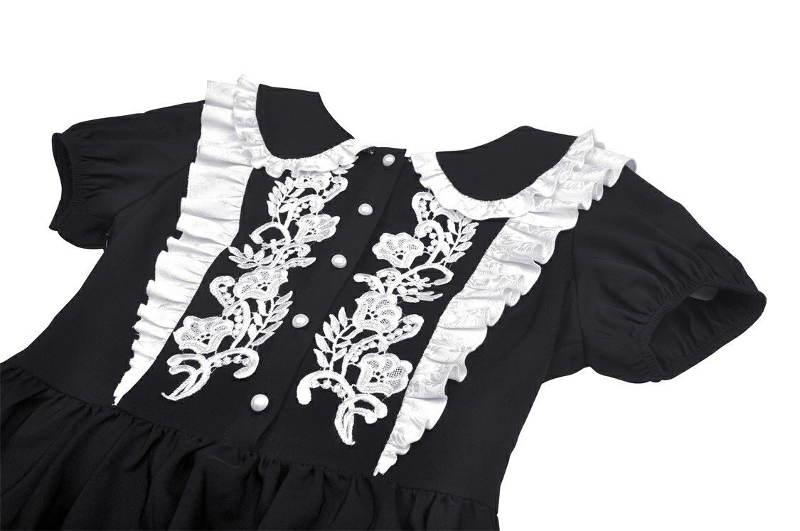 Elegant black dress with white floral embroidery and Peter Pan collar, perfect for chic occasions.