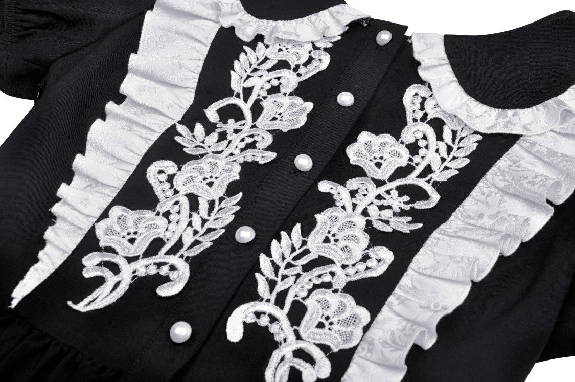 Elegant black dress featuring intricate white floral embroidery and a charming Peter Pan collar.