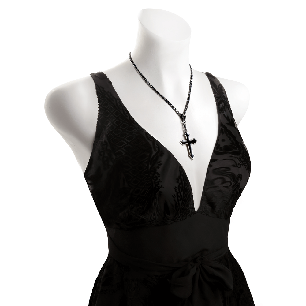 Elegant black dress showcased with gothic pewter skull cross pendant necklace.