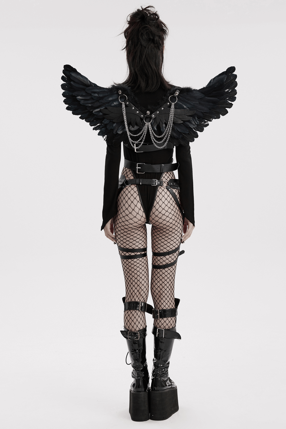 Elegant black feather wings worn with a stylish outfit, perfect for costumes and themed events.