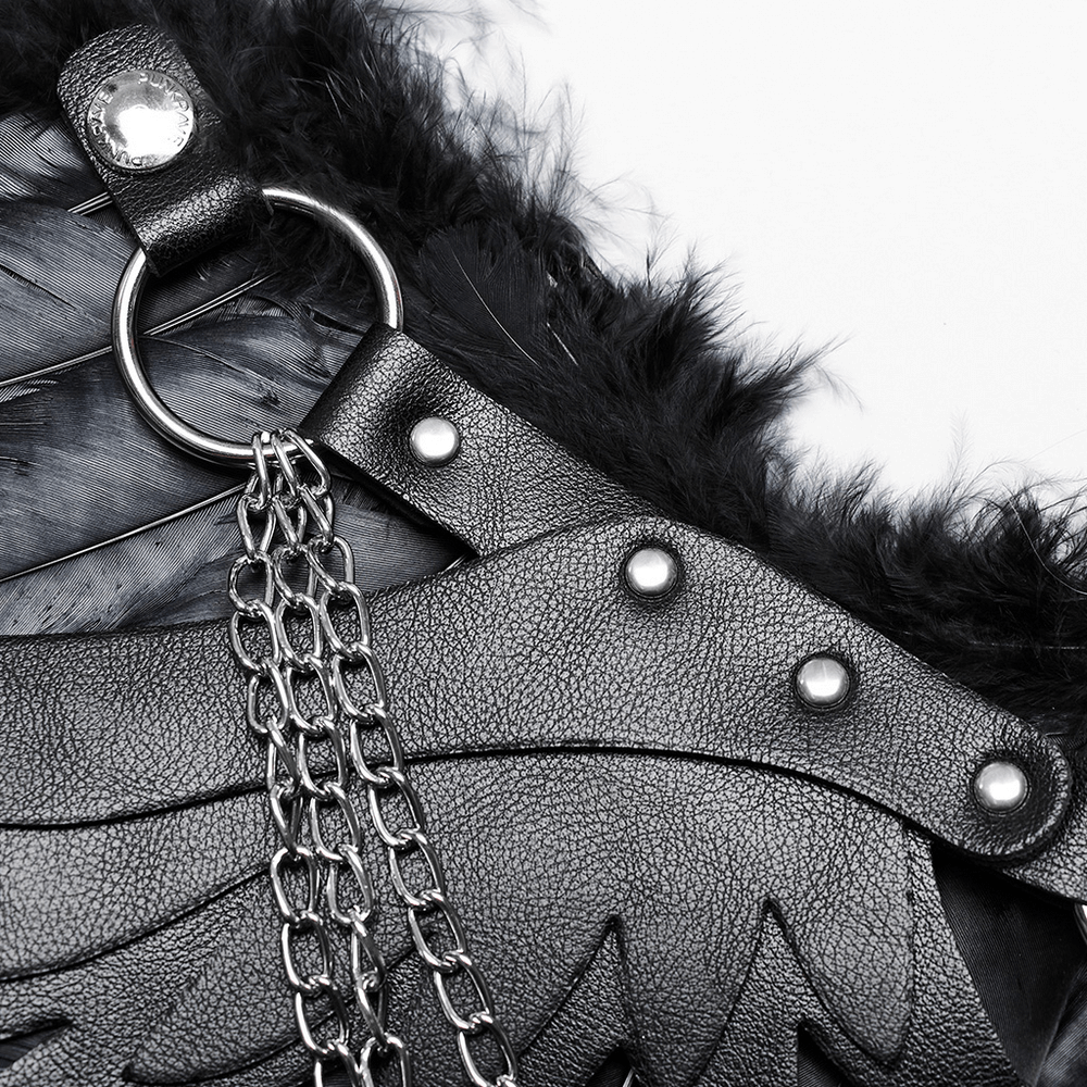 Close-up of adjustable straps and detailing on elegant black feather wings for costumes and events.