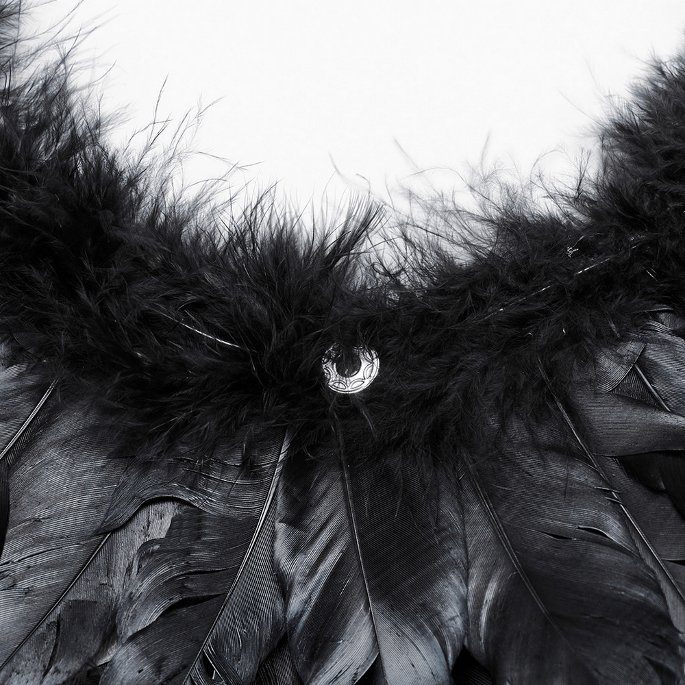 Close-up of elegant black feather wings showcasing detailed craftsmanship, perfect for dark angel costumes and events.