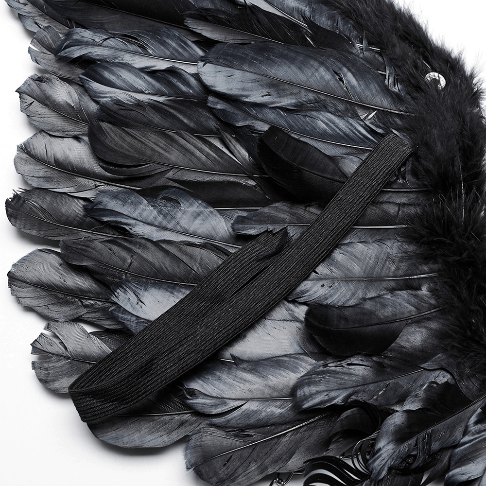 Elegant black feather wings with adjustable straps, perfect for costumes and themed events.