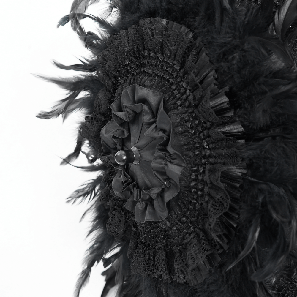 Close-up of an elegant black feathered Gothic umbrella with intricate lace and bead detailing.