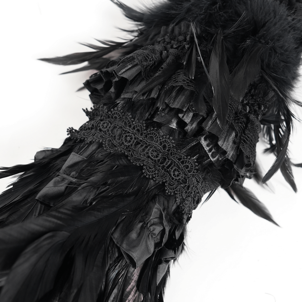 Close-up of luxurious black feathers and lace detail on a Gothic umbrella, perfect for dark fashion enthusiasts.