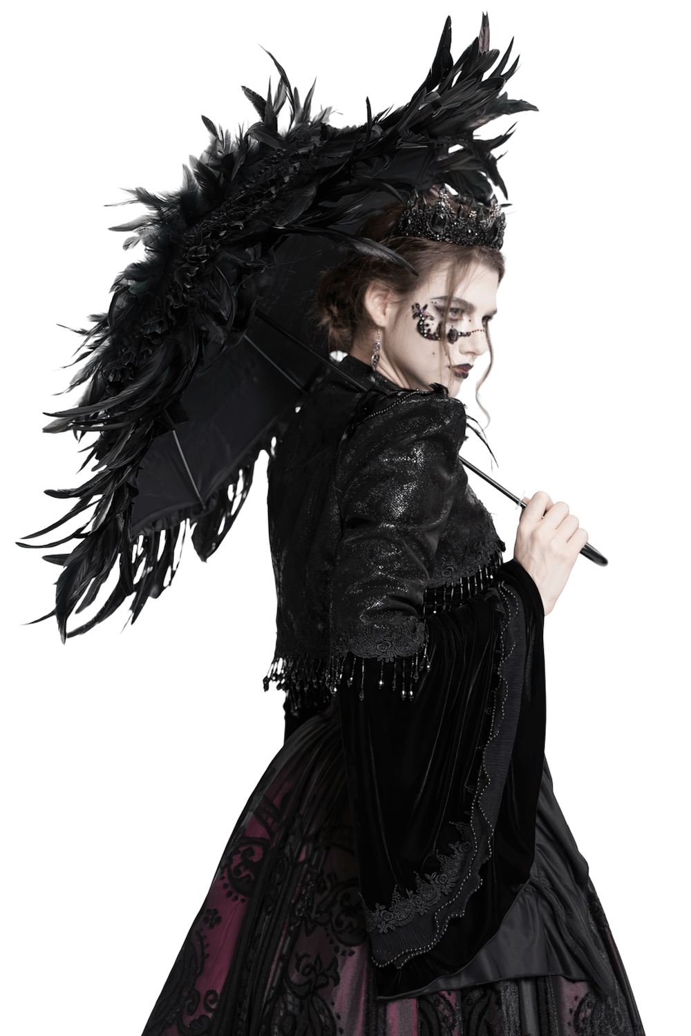 Elegant black feathered Gothic umbrella with beaded detail held by a stylish model in dark fashion attire.