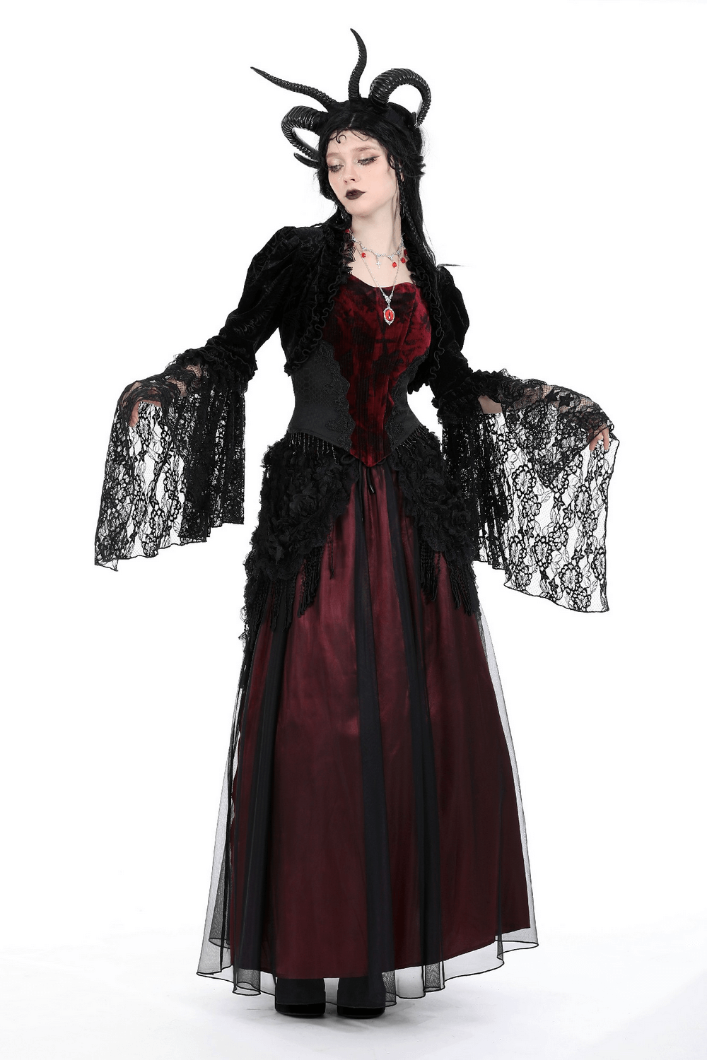 Elegant black lace bolero with flared sleeves, styled over a dark red dress, perfect for evening events.