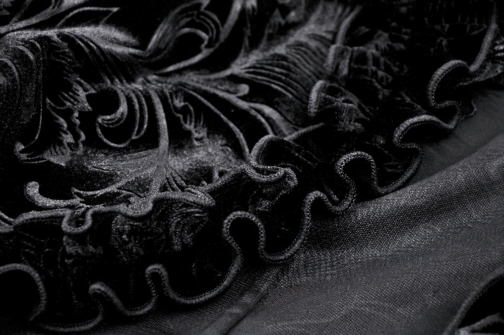 Elegant black lace fabric with intricate detailing and ruffled edges, perfect for evening wear accessories.