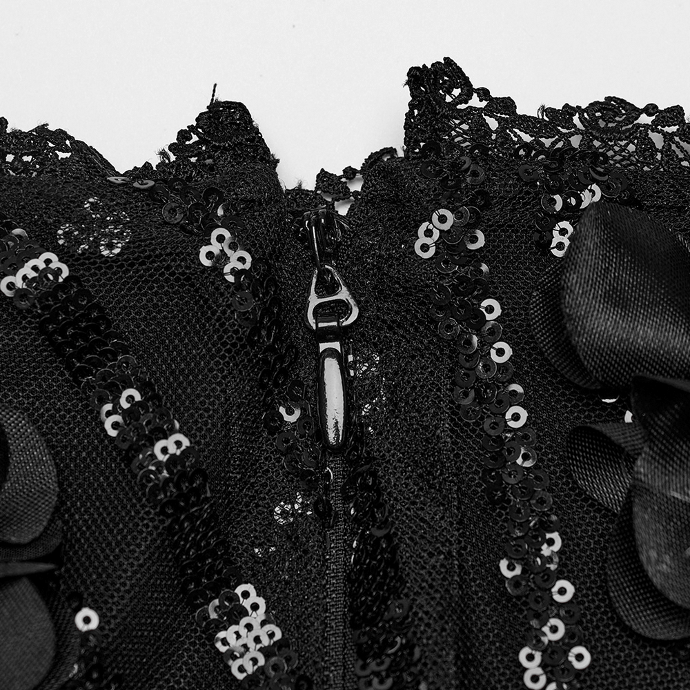 Close-up of the elegant black skirt's invisible zipper and sparkling beaded lace detail.