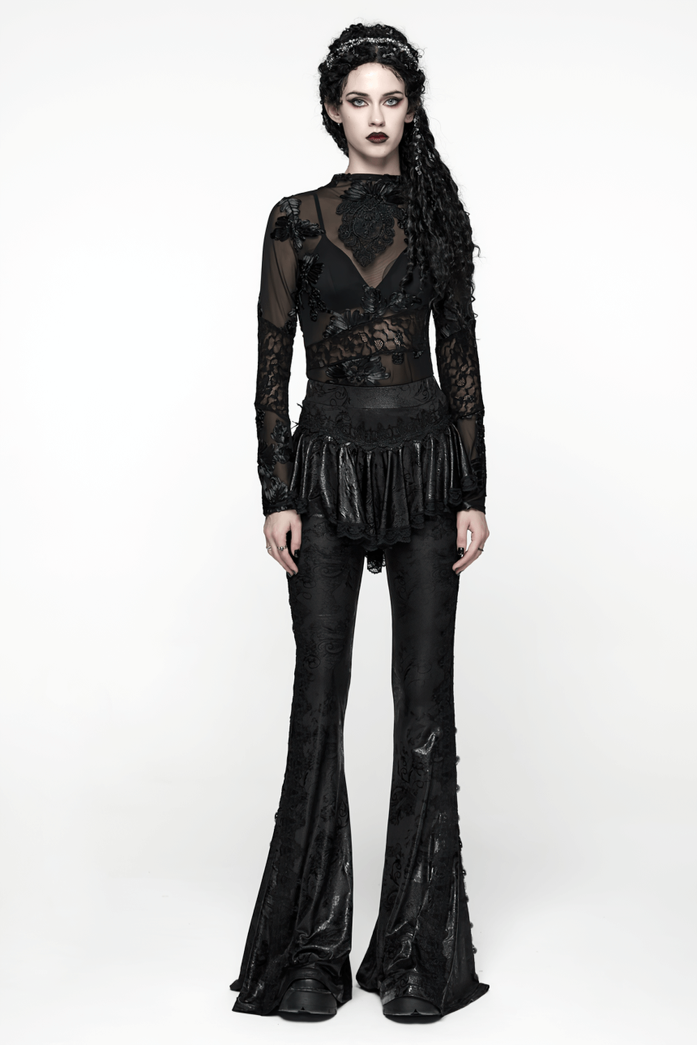 Elegant Black Gothic Flared Pants with Lace Skirt Overlay worn by a model in a dramatic pose.