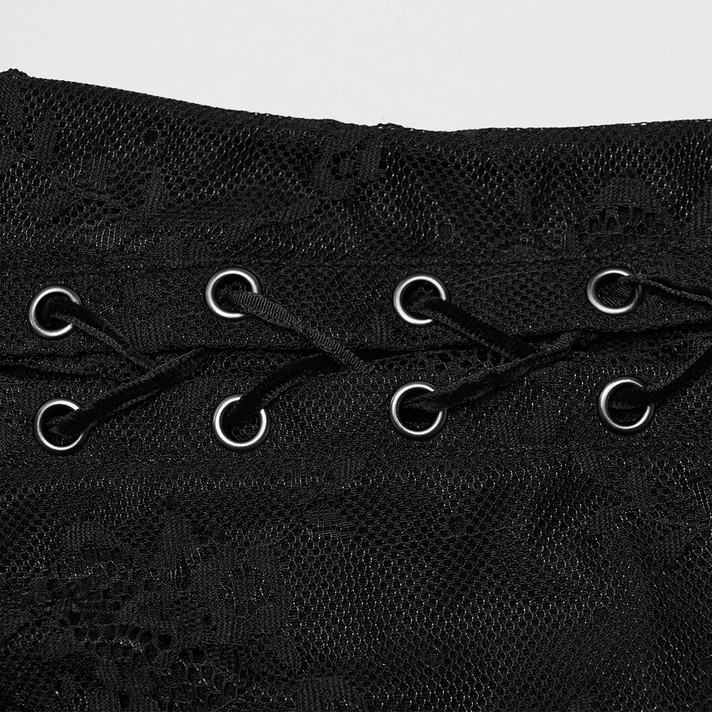 Close-up of black gothic lace dress featuring unique studded lace webbing and adjustable drawstring details.