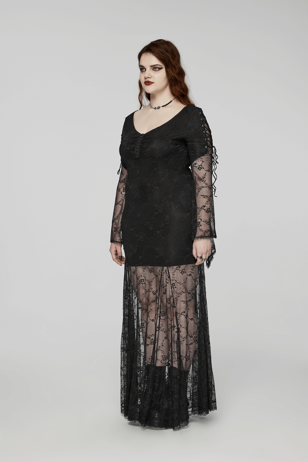 Elegant black gothic lace dress featuring knitted fabric and studded lace webbing, perfect for a vintage-inspired look.