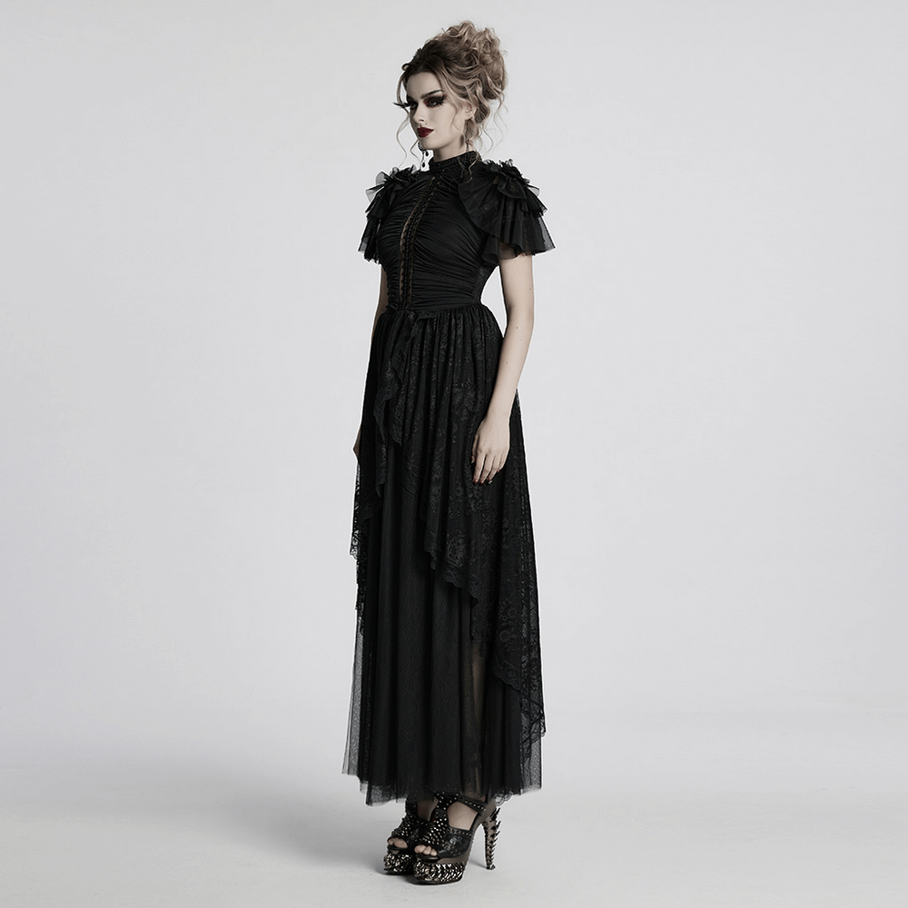Elegant black gothic lace maxi dress with sheer back and beaded neckline, featuring ruffles and layered sleeves.