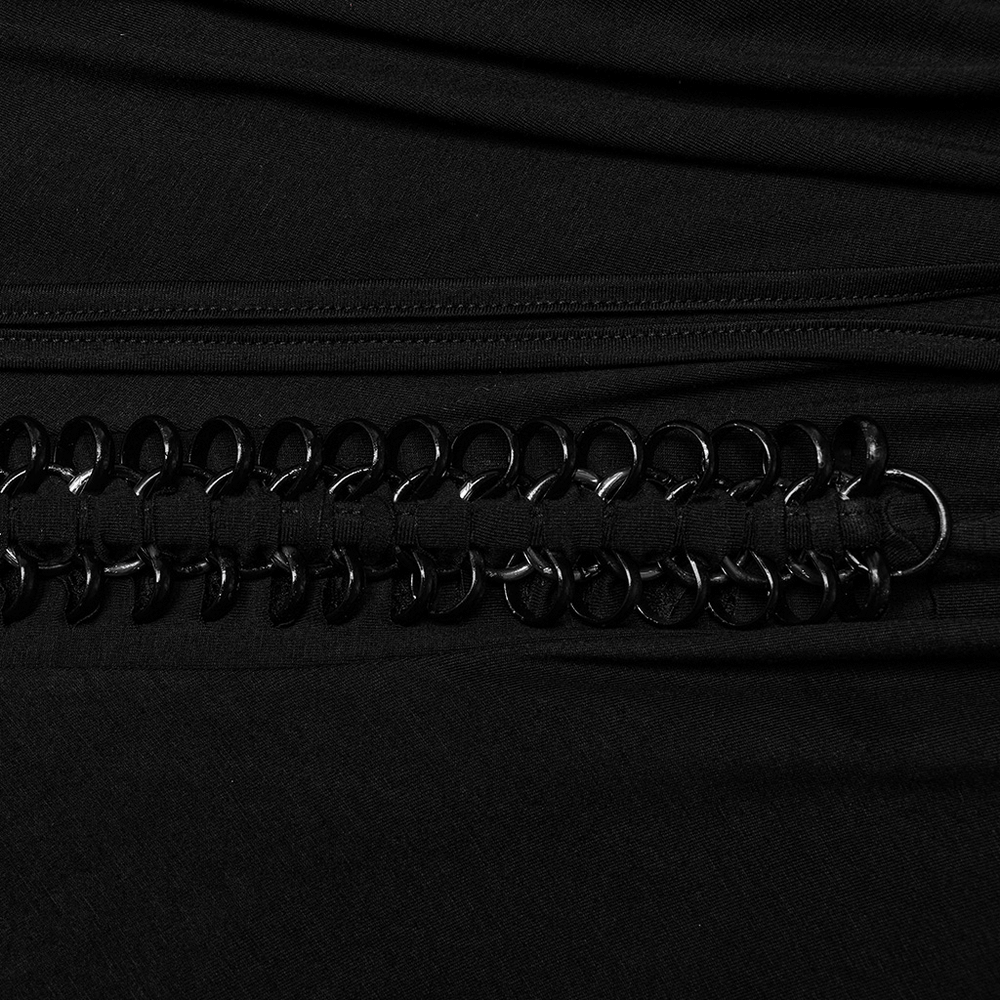 Close-up of elegant black gothic skirt with lace and pleated design featuring iron chains detail.