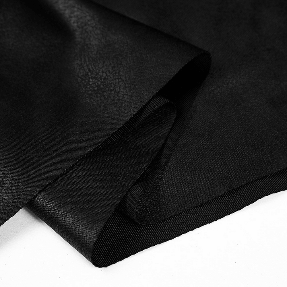 Black textured fabric draping elegantly, perfect for Gothic fashion and witch-themed attire.