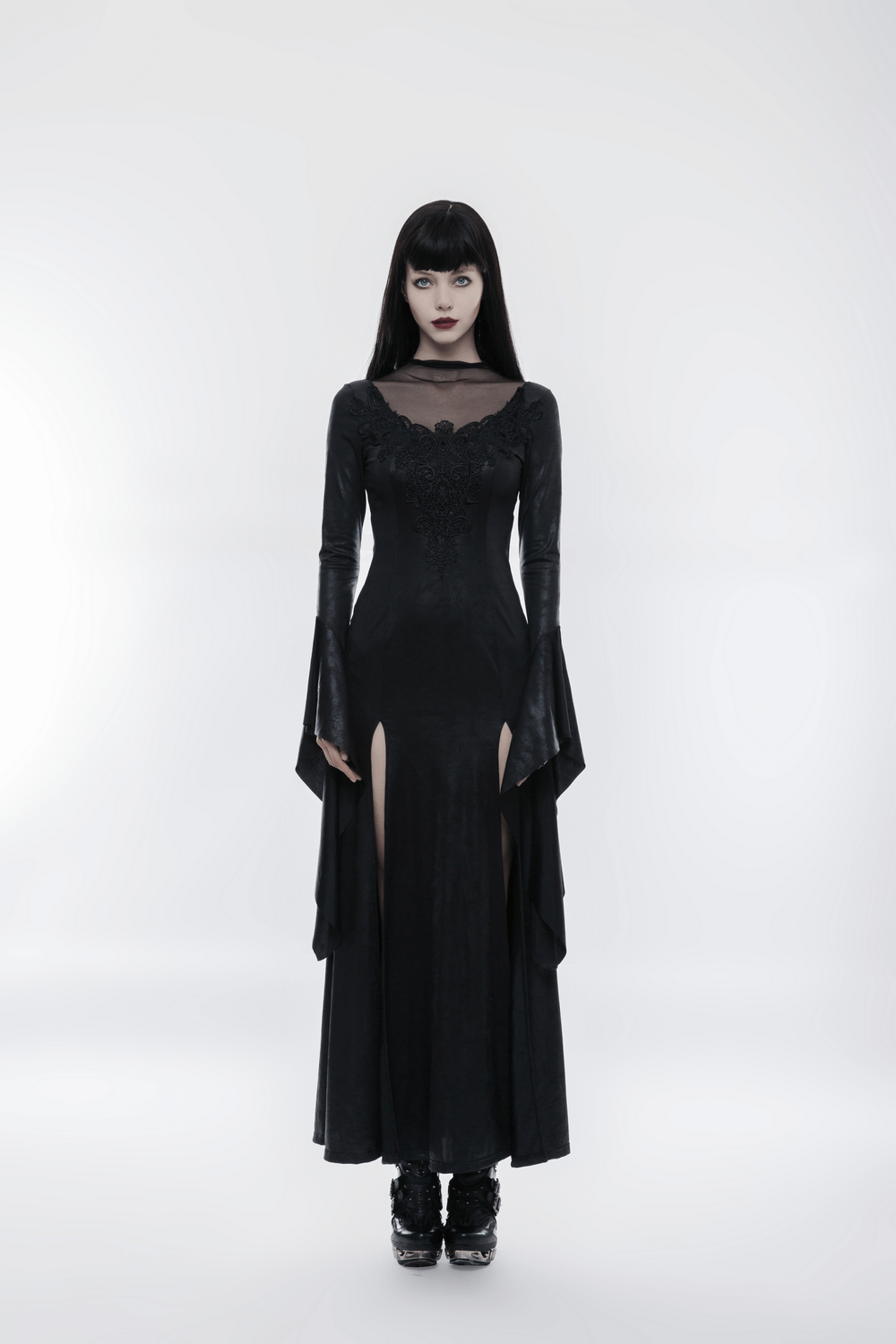 Elegant black gothic dress with high slit and lace details, perfect for witchy vibes and spooky style.