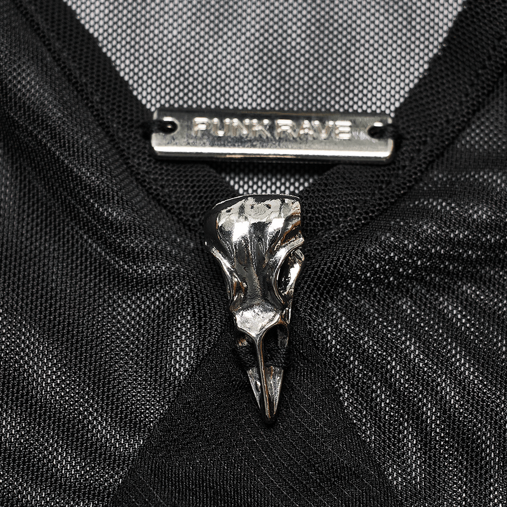Close-up of Punk Rave dress featuring a gothic metal skull detail on a black mesh fabric.