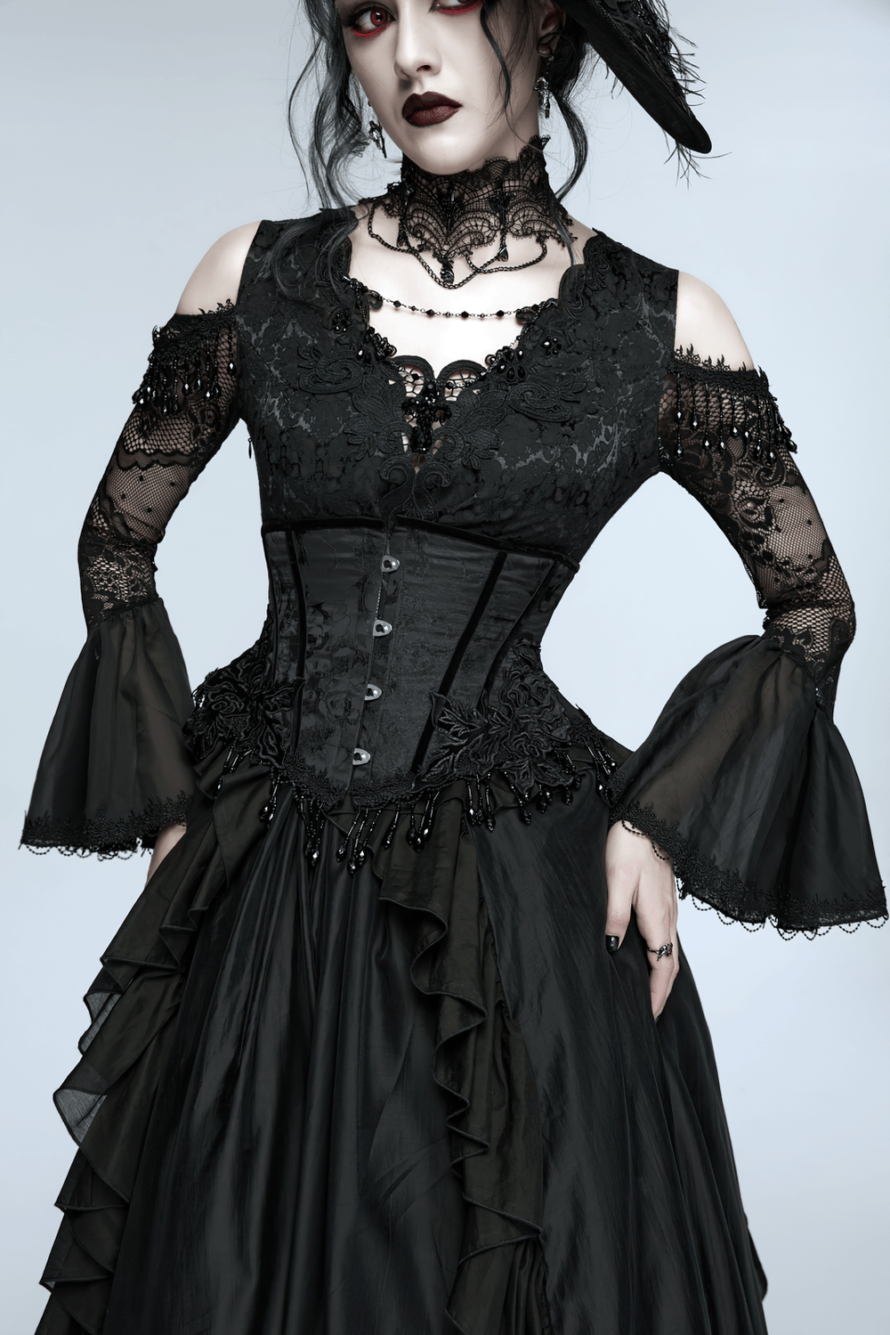 Alt Tag: Elegant Black Gothic Rose Lace-Up Underbust Corset styled with black lace gothic dress, jacquard waist shaping and beaded fringe drama