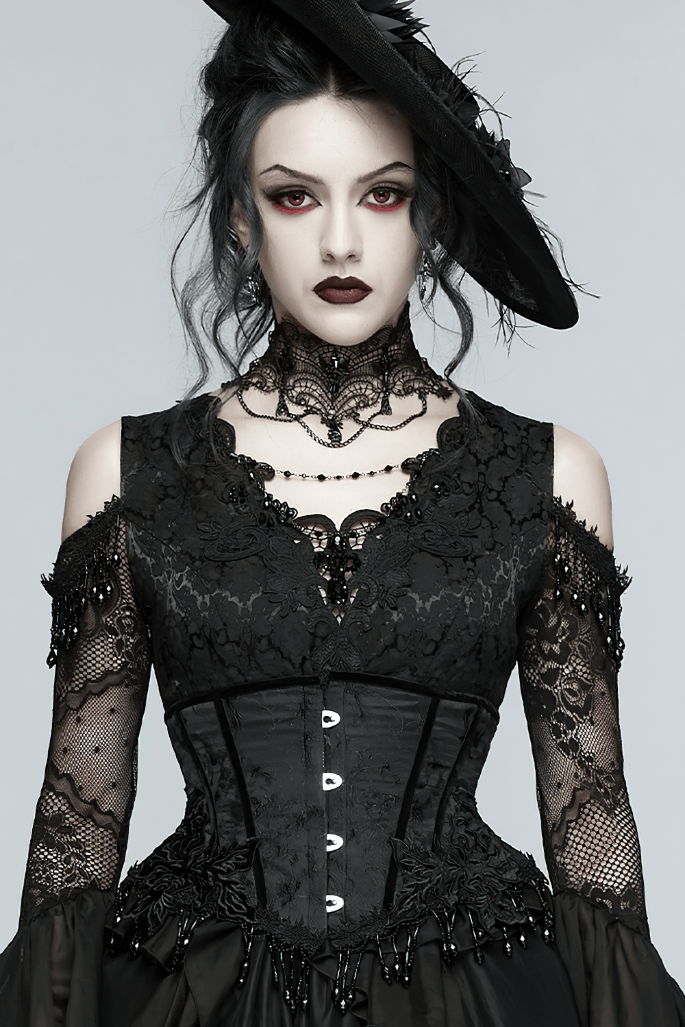 Alt Tag: Elegant Black Gothic Rose Lace-Up Underbust Corset worn with black lace dress, beaded fringe detail, dramatic gothic styling