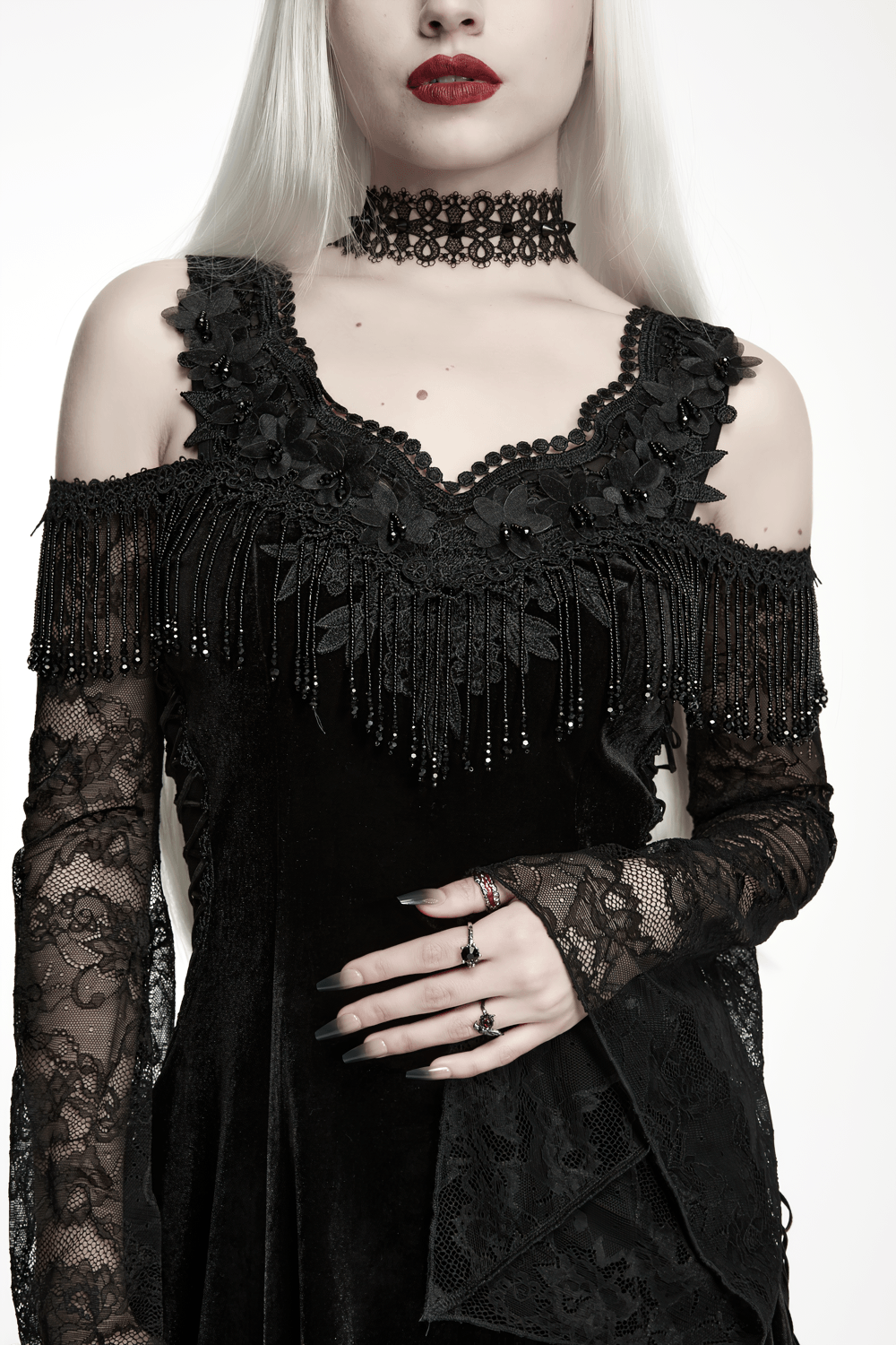 Elegant Black Gothic Velvet High-Low Dress with Lace Sleeves featuring beaded fringe and cold-shoulder lace design.
