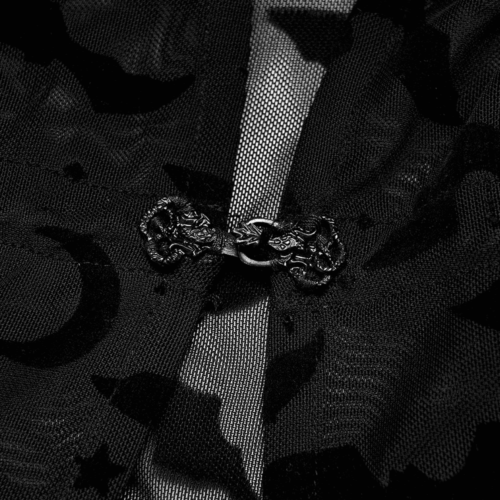 Close-up of the elegant black lace bat print kimono-cape showcasing intricate hook detail and delicate flocking design.