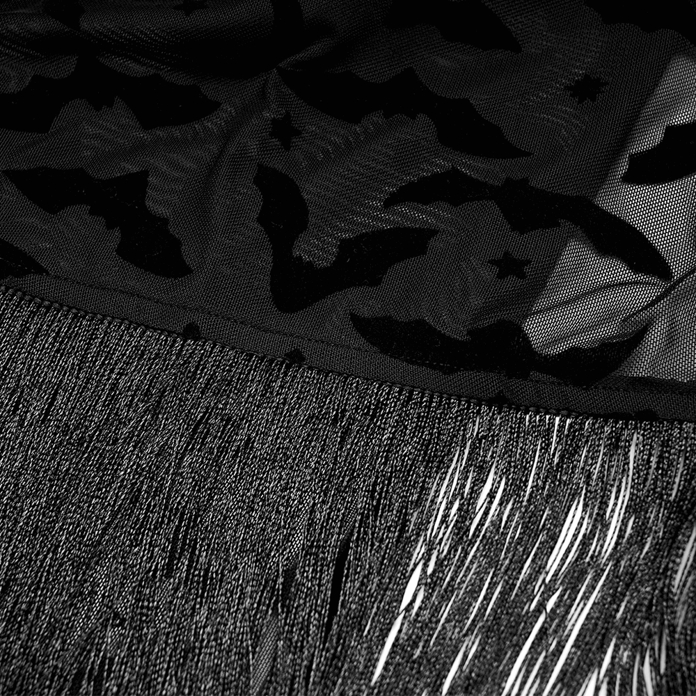 Close-up of black lace kimono detailing with bat pattern and tassel hem, showcasing gothic elegance.