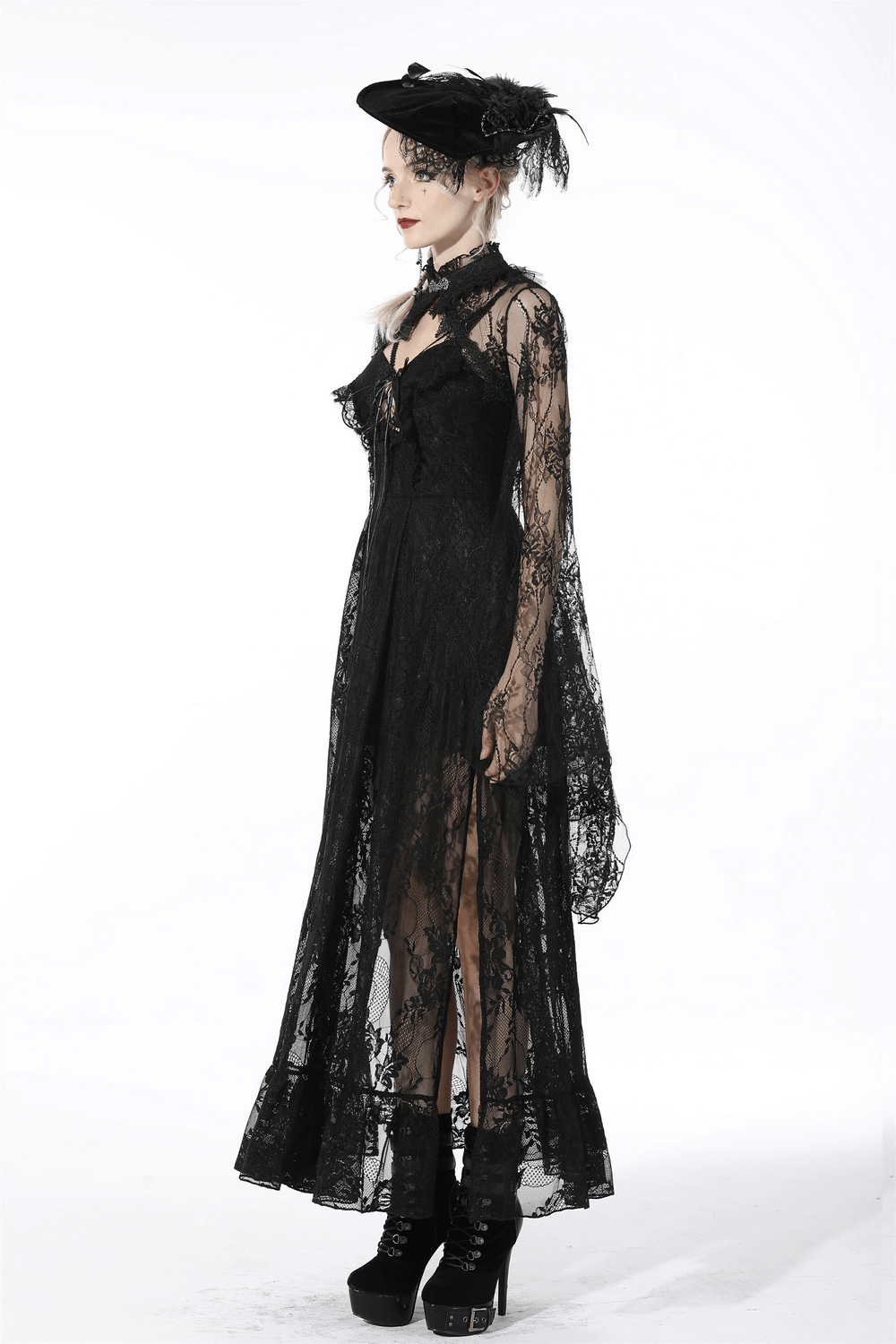 Elegant black lace cape with long bell sleeves worn by a model, perfect for gothic fashion and dramatic looks.