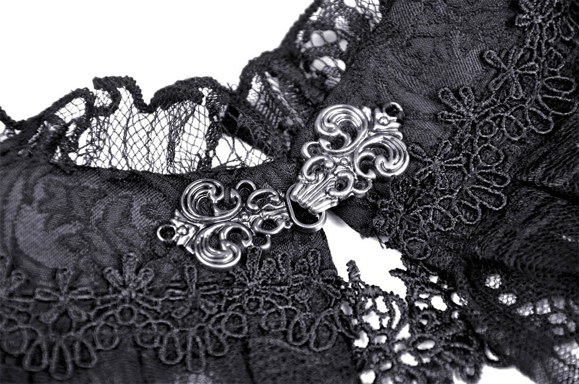 Close-up of intricate black lace detailing with ornate silver clasp, perfect for gothic fashion accessories.