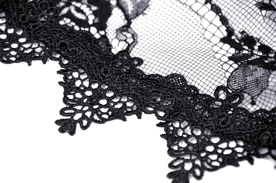 Close-up of elegant black lace fabric, showcasing intricate patterns and delicate details of Gothic lace design.
