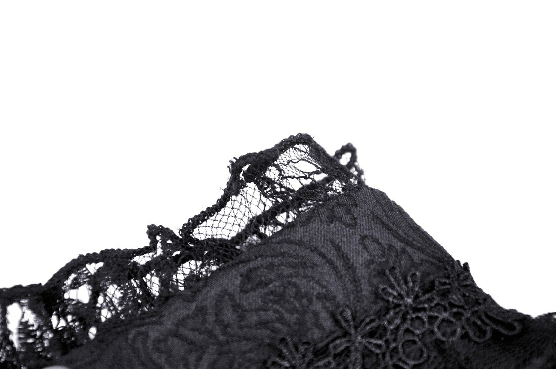 Close-up of elegant black lace detail showcasing intricate patterns and textures, ideal for gothic fashion enthusiasts.