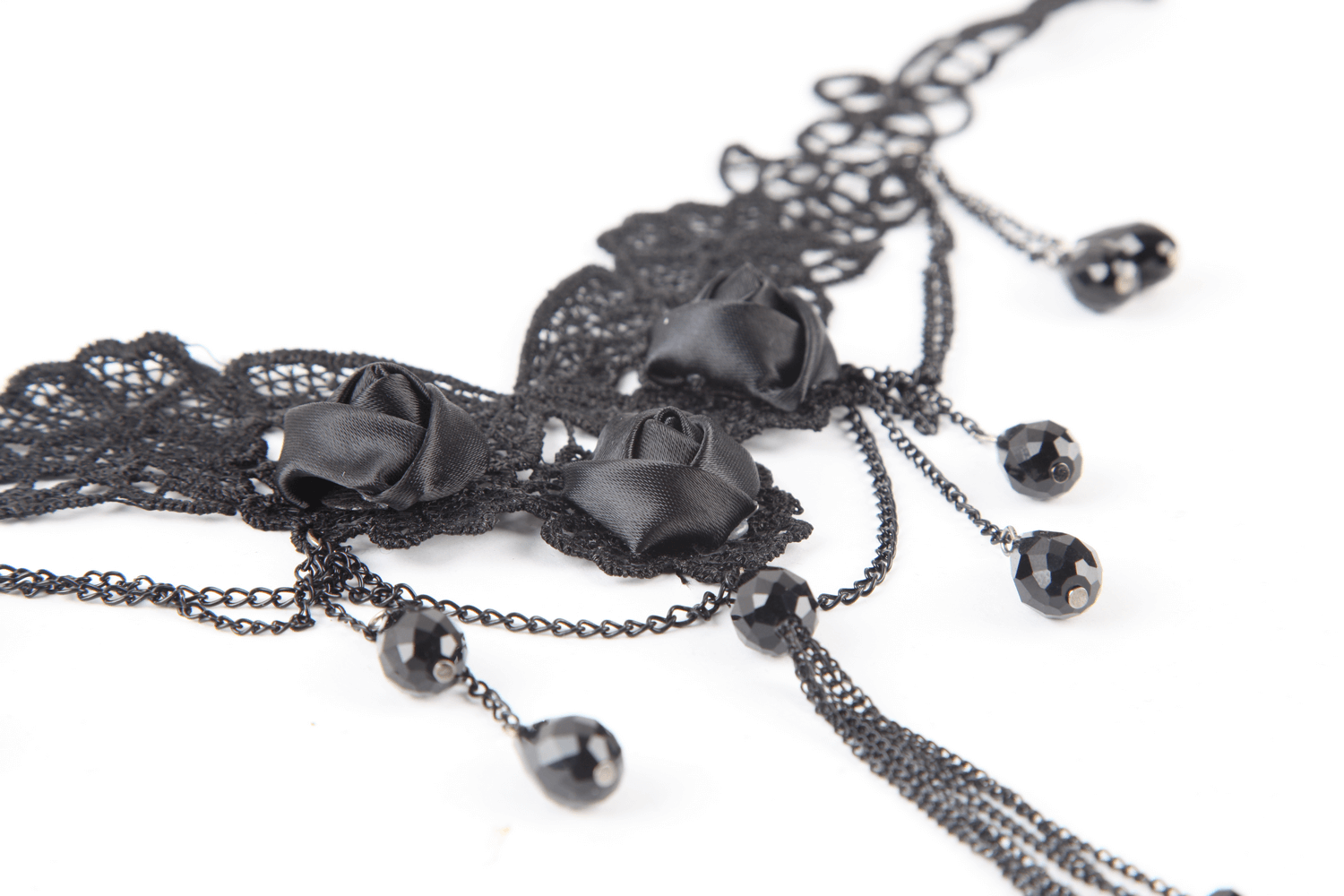 Elegant black lace choker with roses and drop details, perfect for gothic-inspired fashion.
