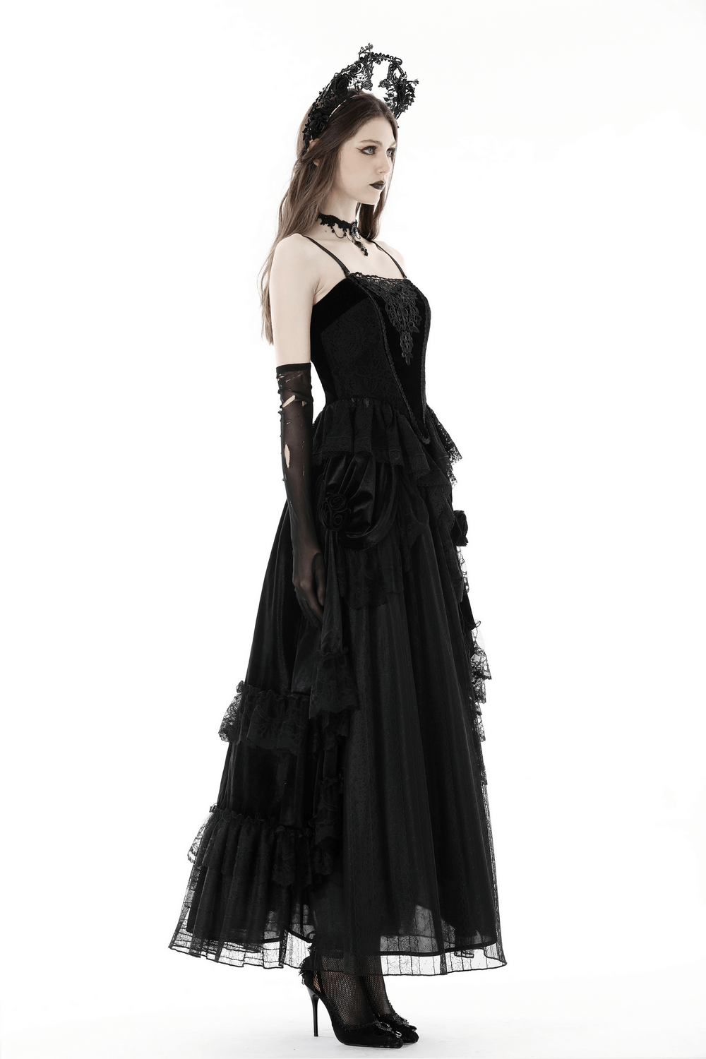 Elegant black lace corset top with flowing skirt and gothic details, perfect for evening wear.