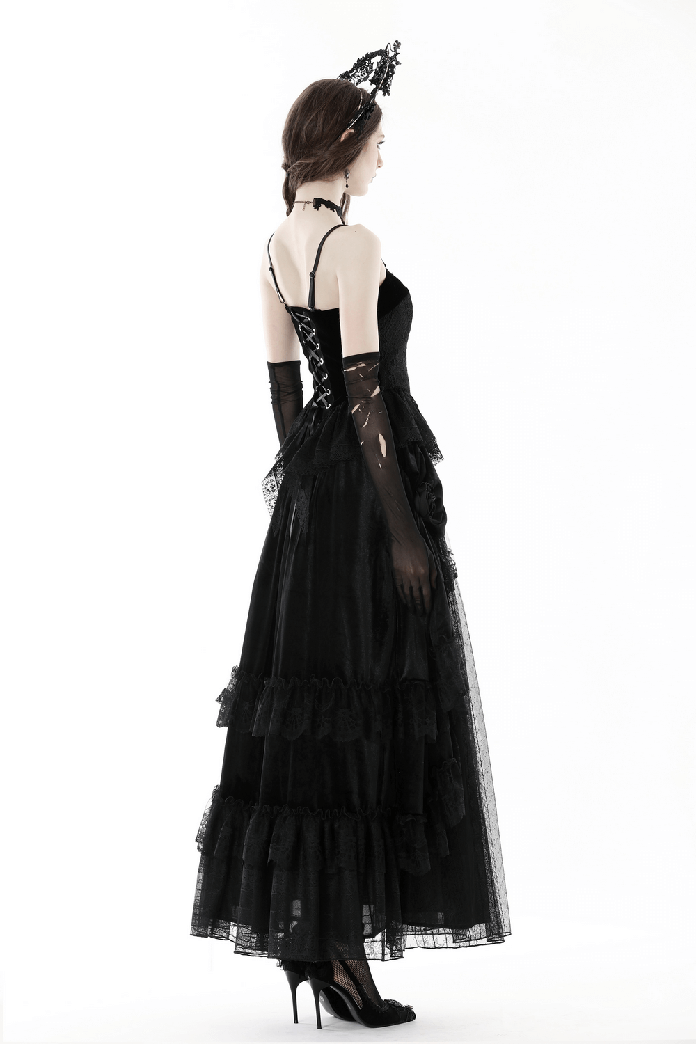 Elegant black lace corset top with layered skirt, perfect for gothic-inspired evening wear, showcasing detailed floral design.