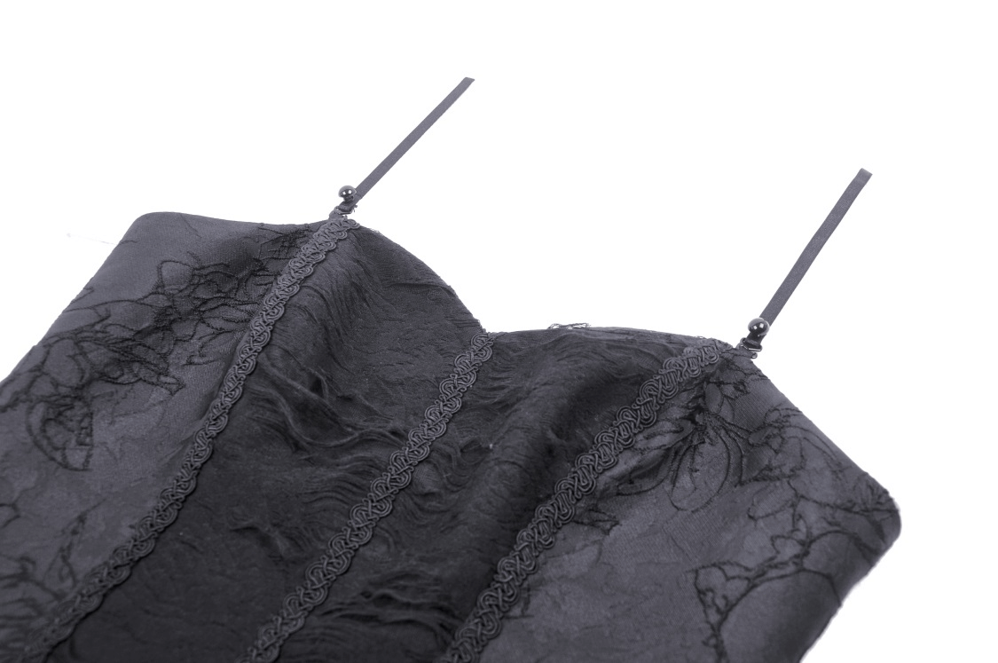 Elegant black lace dress neckline with floral detailing and delicate spaghetti straps.