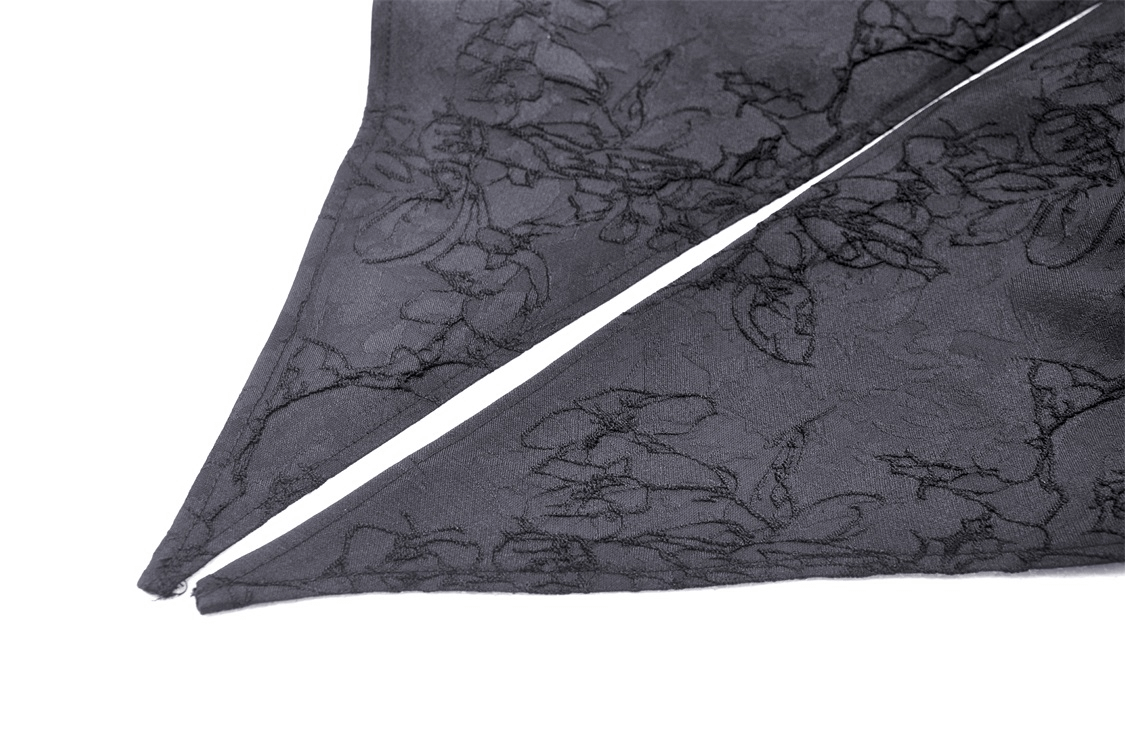 Elegant black lace fabric featuring intricate floral detailing and an asymmetrical cut.