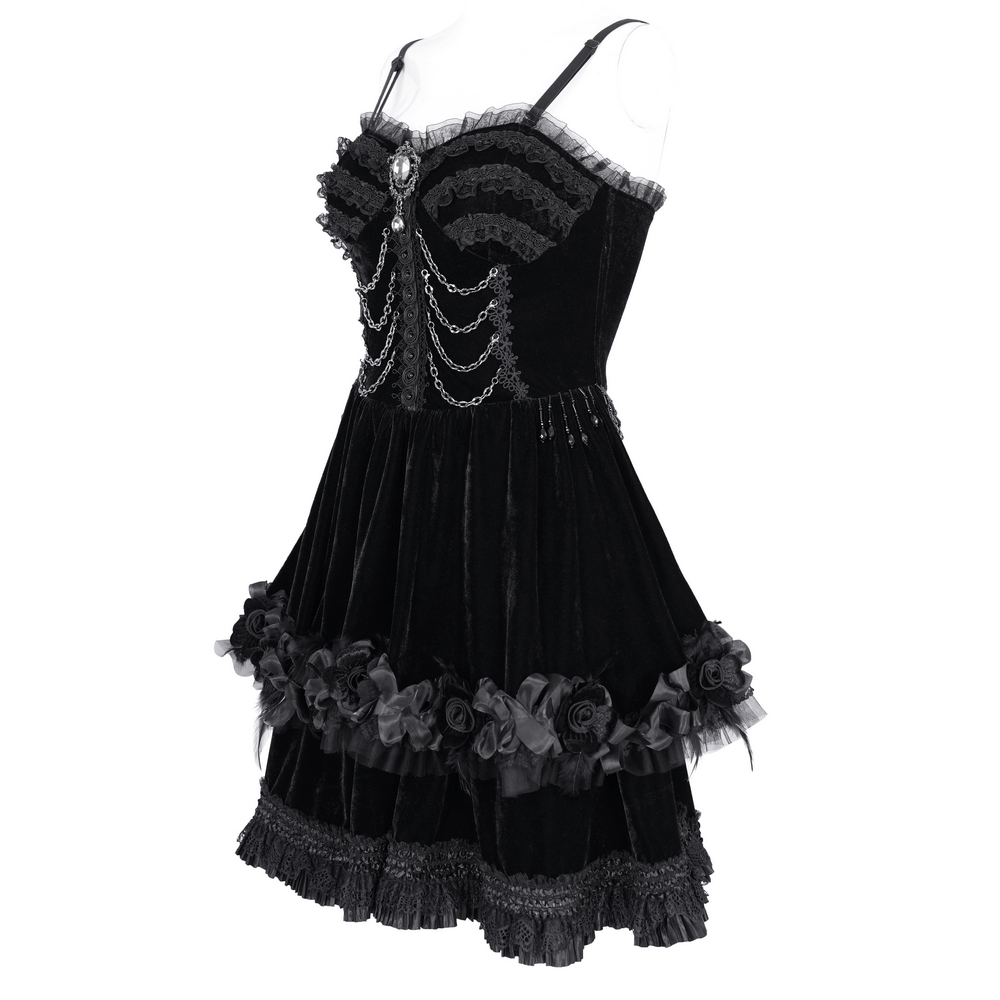 Elegant black evening dress with lace and floral accents, featuring delicate beading and chains for a chic, sophisticated look.